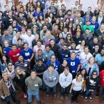 Large group of workers standing for a group picture.