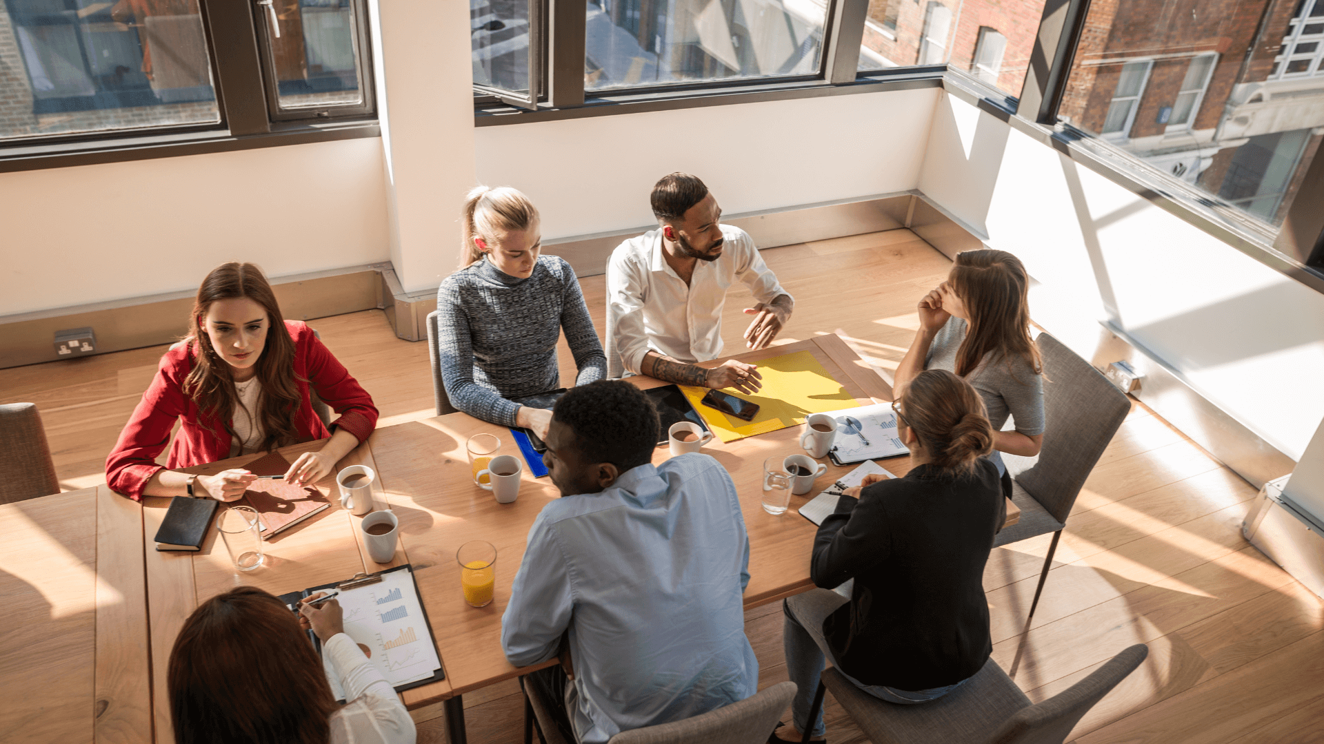 Corporate conference room meeting from overhead.