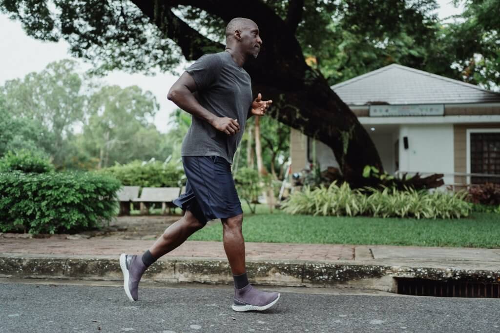 Man running for wellness program participation
