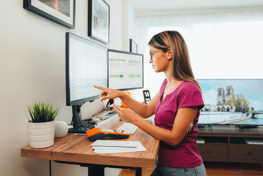 A woman at a standing desk