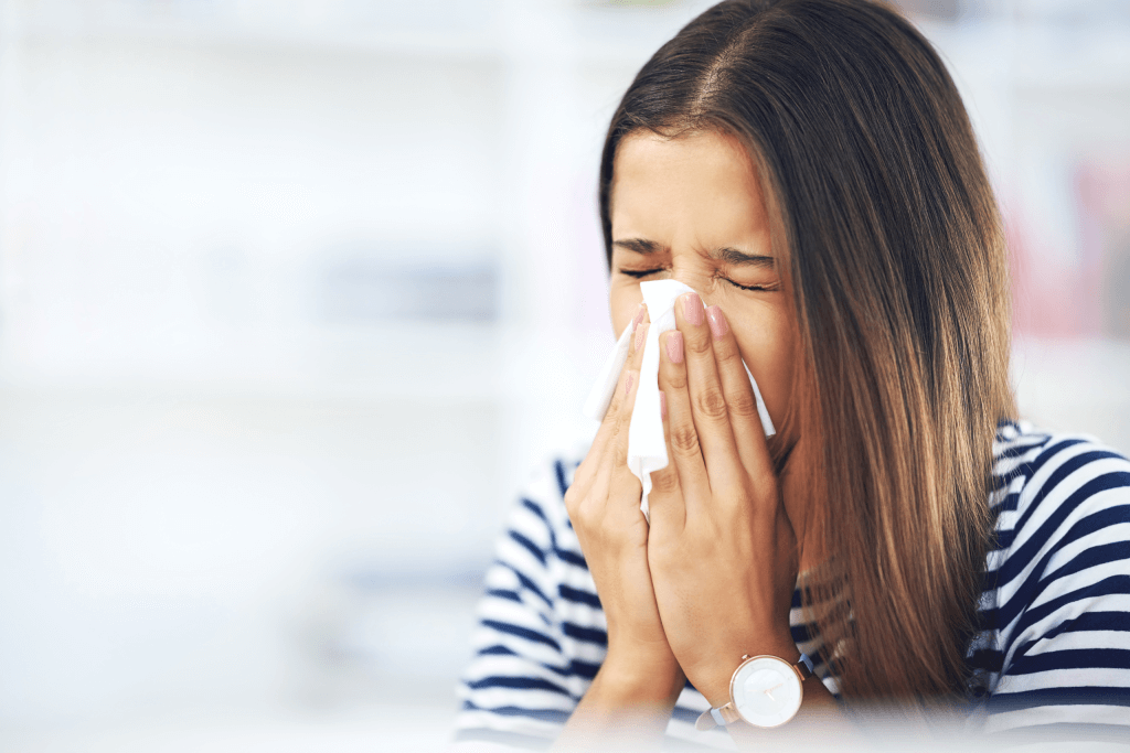 A Woman Blowing Her Nose