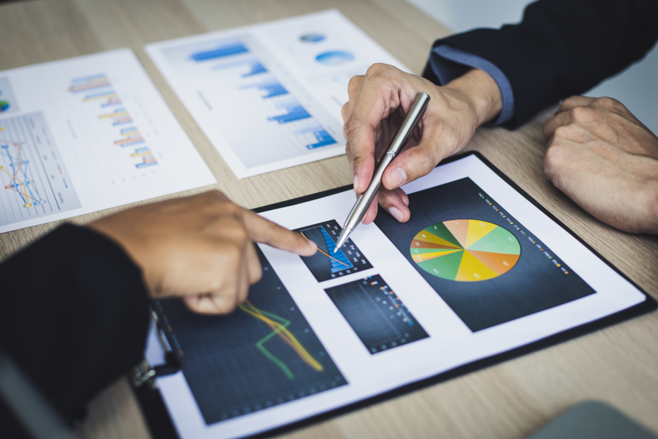 Two businessmen discussing a financial report