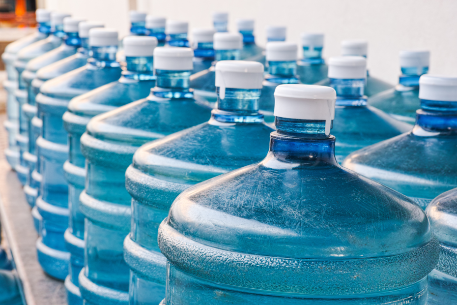 rows of blue water cooler jugs