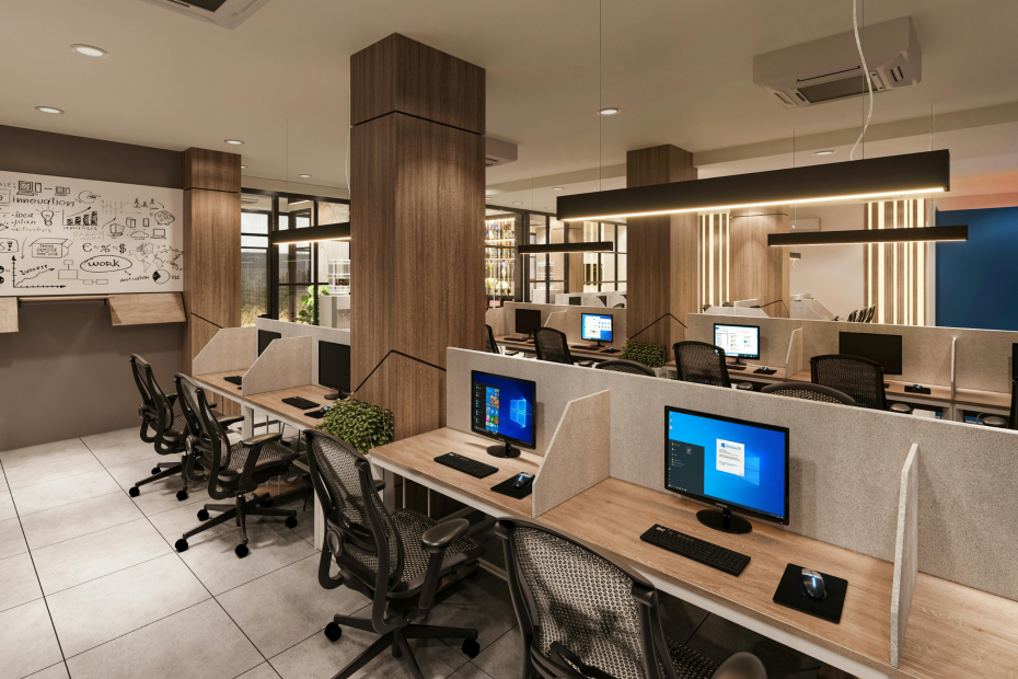 Modern office workspace with desks, computers, and collaborative layout, illustrating how the physical work environment directly influences employee health, productivity, and overall workplace wellness.