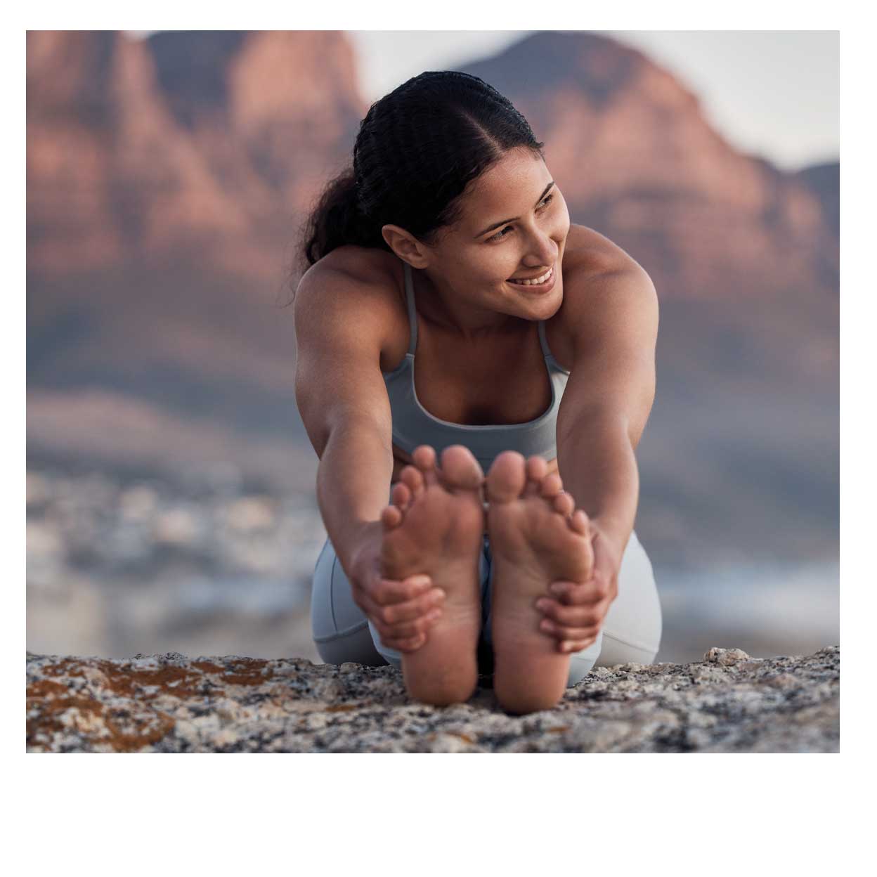 woman stretching in the desert