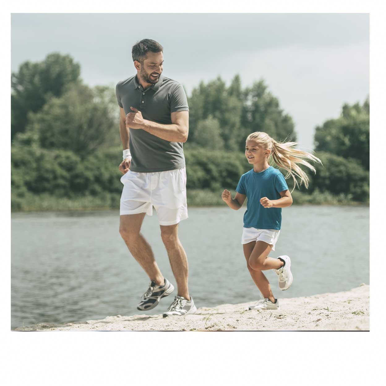 Dad and daughter running on beach