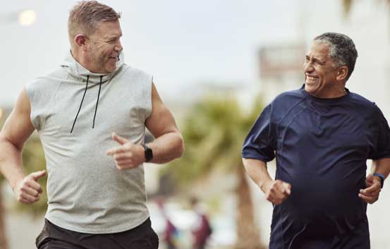 two male employees running