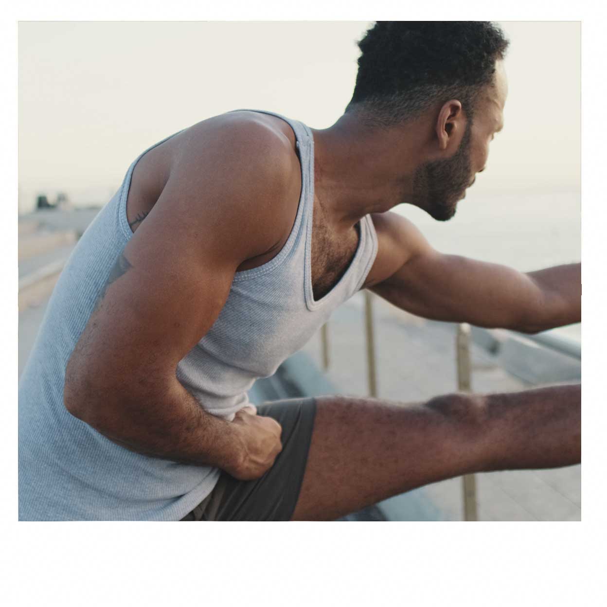 man stretching before run