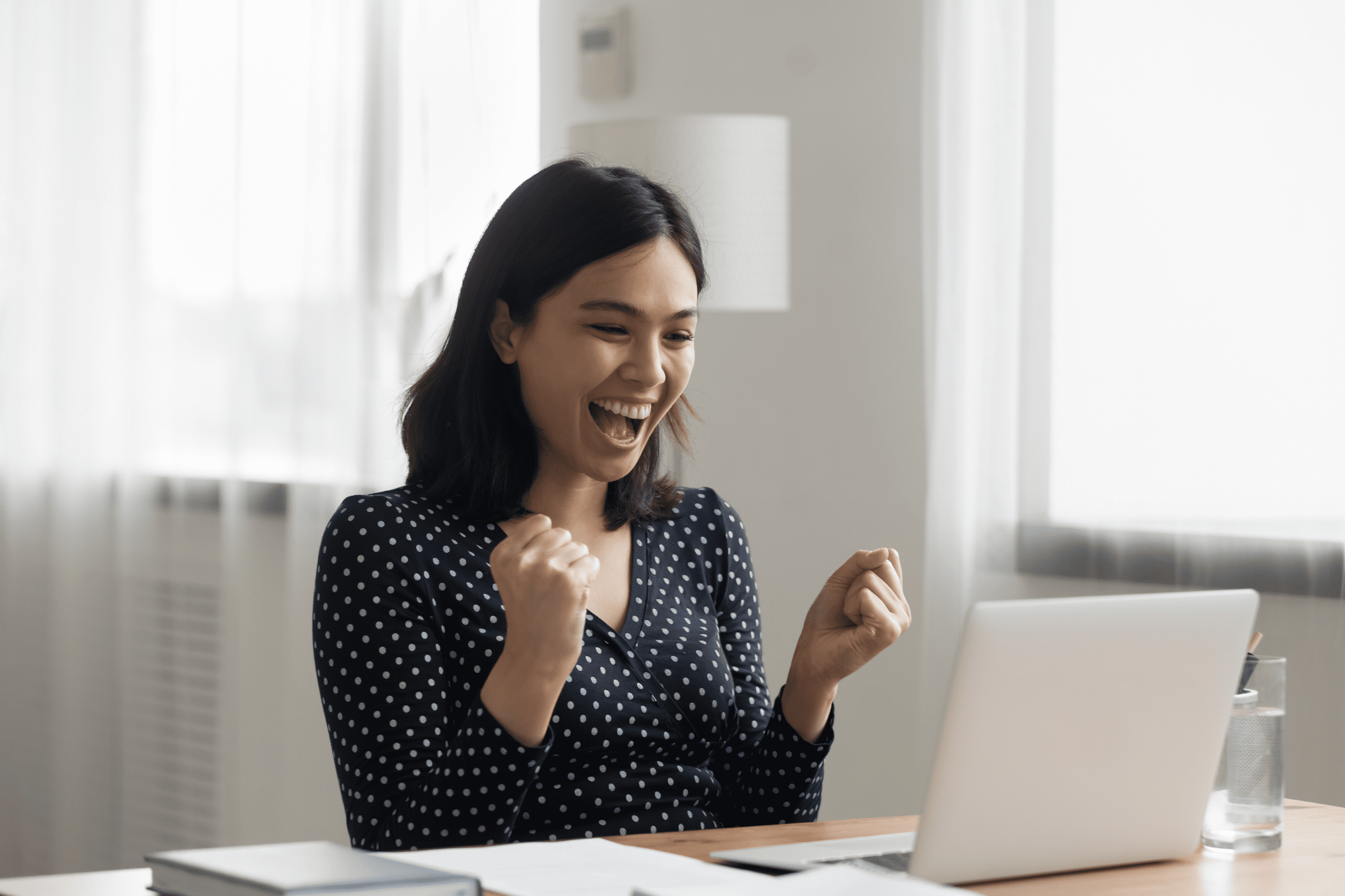 Shows an employee celebrating progress on a wellness platform, highlighting how earning rewards increases engagement and reinforces healthy behavior in workplace wellness programs.